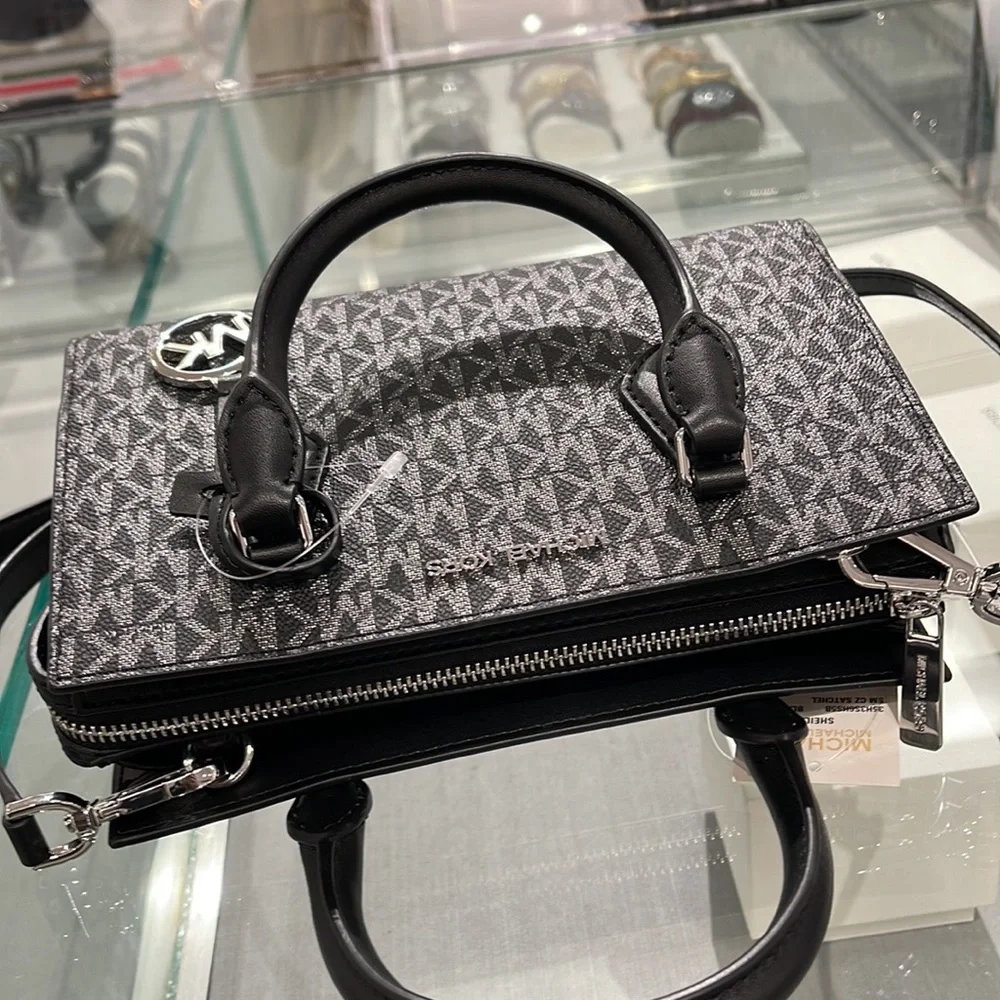 MICHAEL KORS
Sheila Small Faux Saffiano Leather Satchel
Black/Silver
NWT - Picture 16 of 16